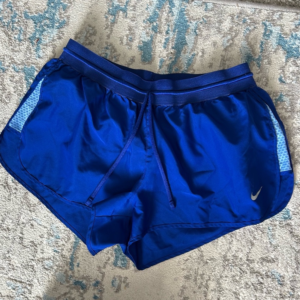 Blue Nike running shorts
